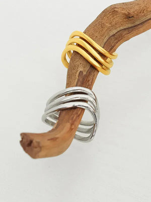 Triple-band sculptural ring in gold and silver, 18K gold-plated bands on wood branch.