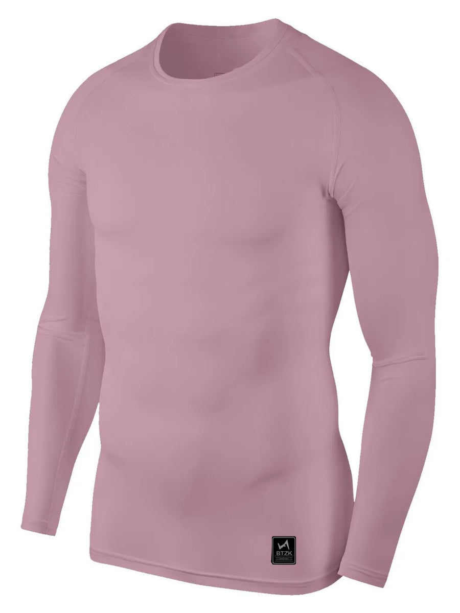 Dusty Pink performance long sleeve tee with crew neck and a small logo tag.