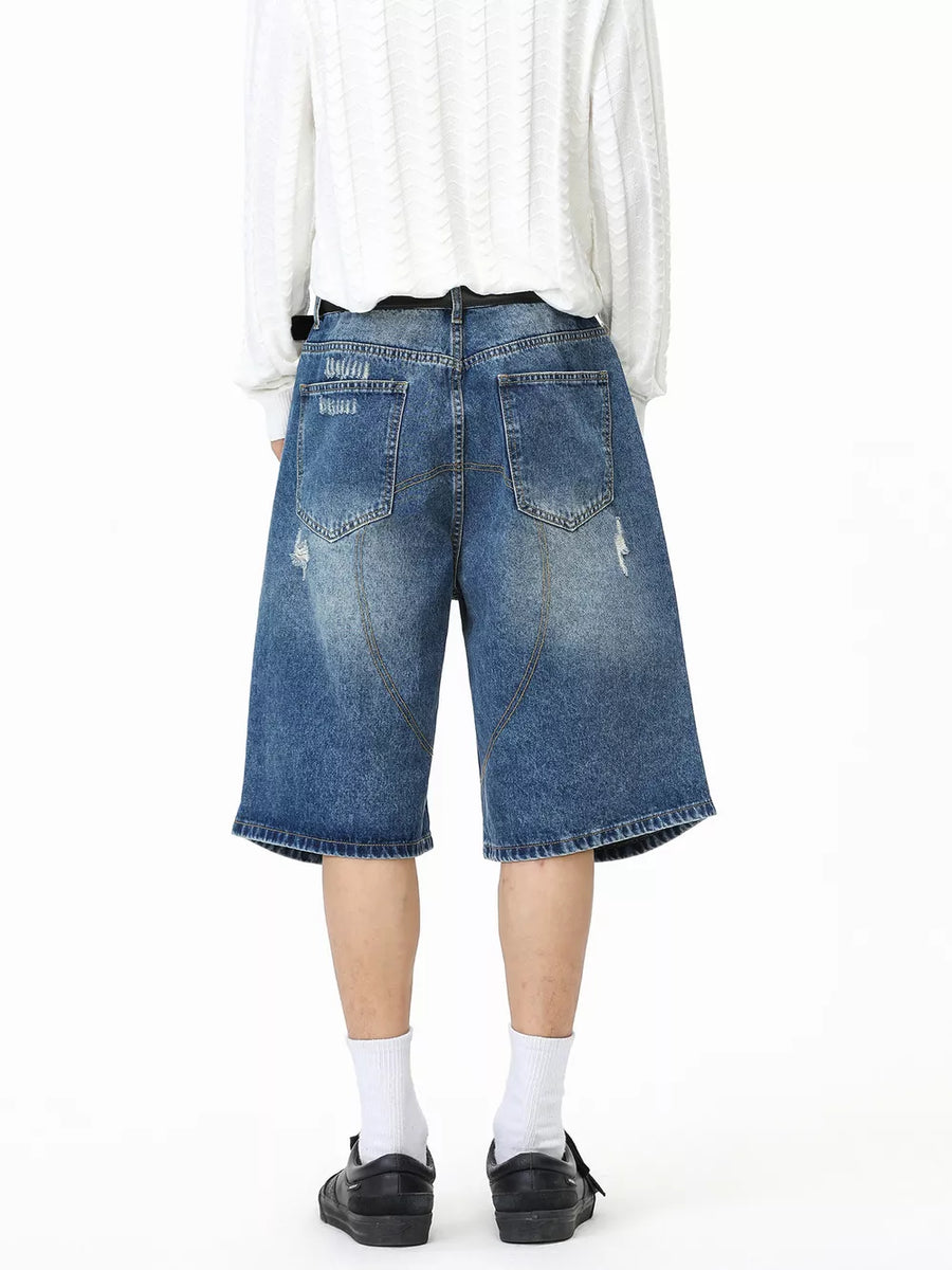 95%cotton, 5%spandex Care instructions: Machine wash cold denim shorts in medium wash blue with loose silhouette