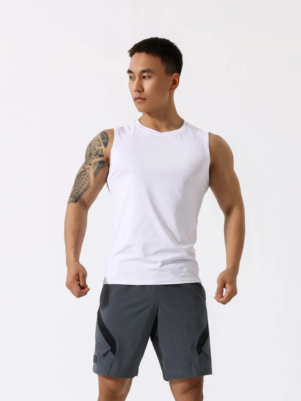 White crew neck sleeveless performance tank top with a breathable fabric.