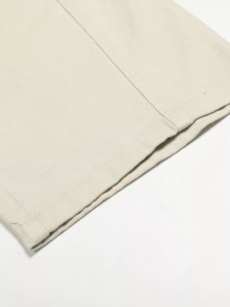 Belted wide-leg maternity pants in cream white with a relaxed fit and cuffed hem detail.