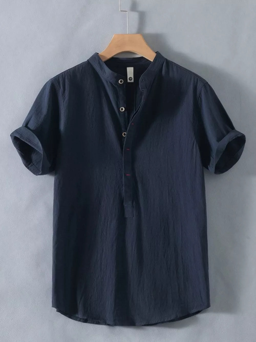 Dark blue cotton short sleeve shirt with band collar and button detail