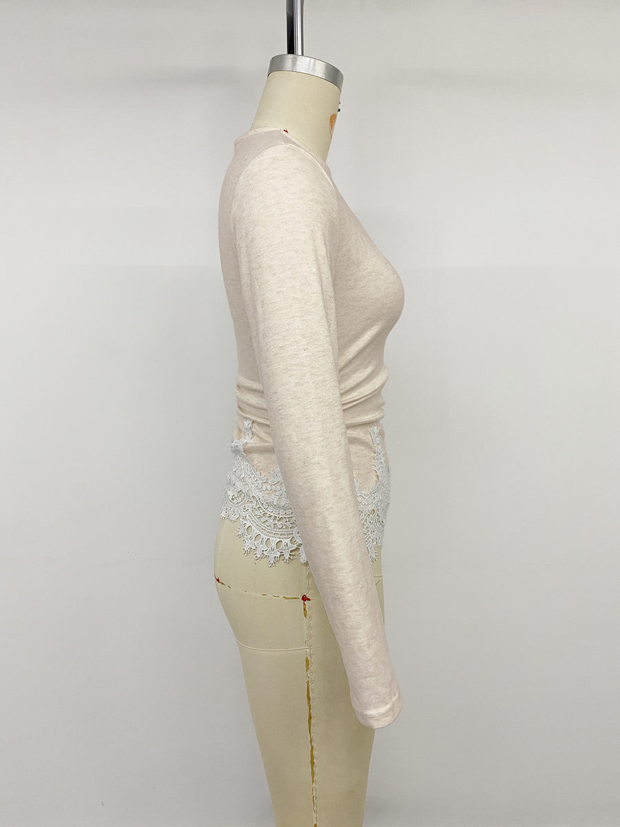 Light pink long sleeve top with white lace trim