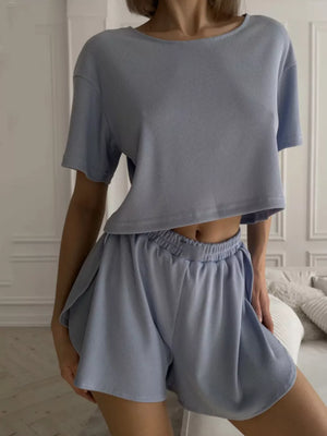 Light blue ribbed knit cropped lounge set with shorts and a t-shirt.