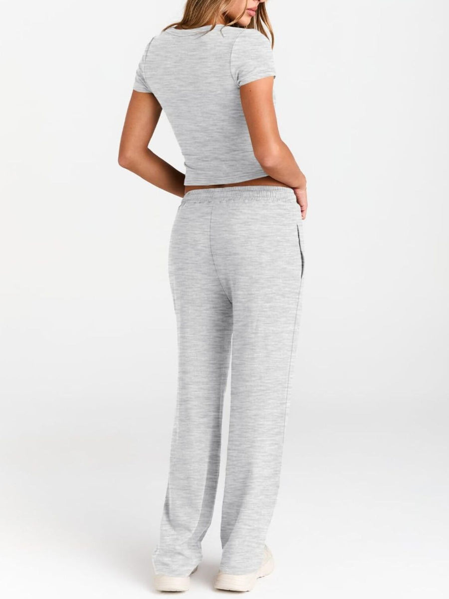 Gray round neck tee and relaxed fit drawstring pants set.