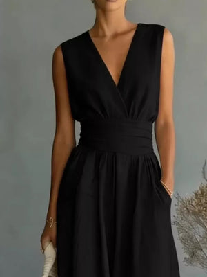 Black sleeveless V-neck midi dress with a cinched waist and pockets