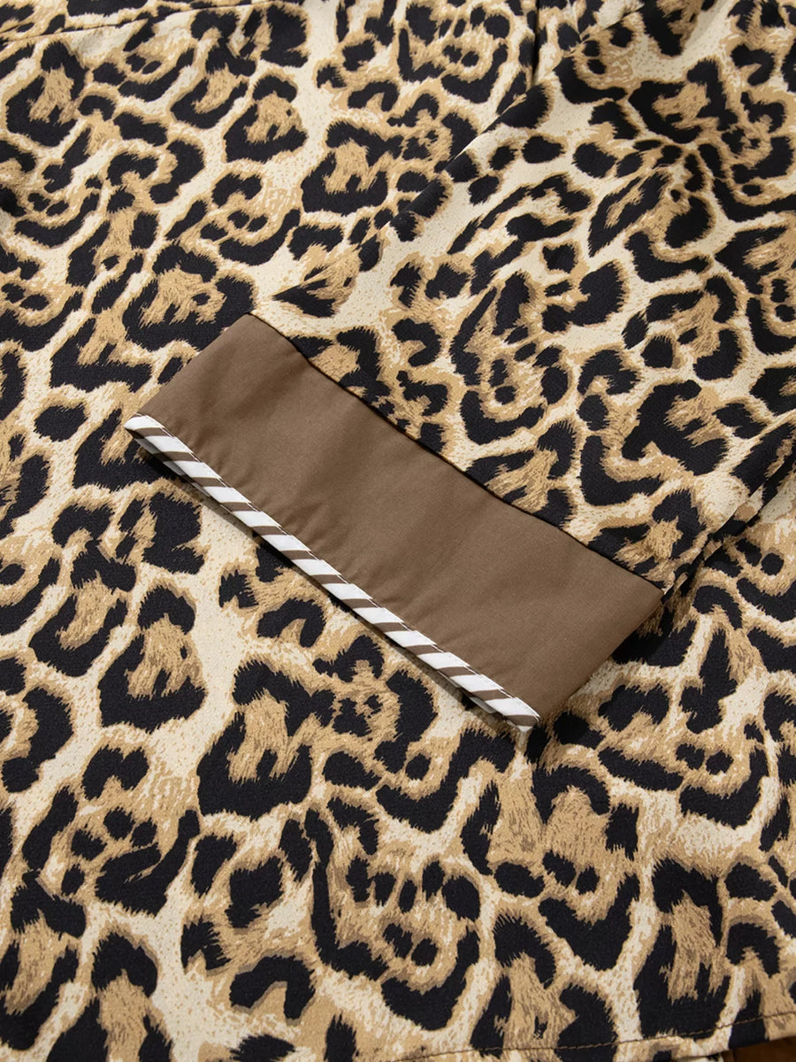 Chic leopard print two-piece set with brown trim and white stripe detail on cuff.