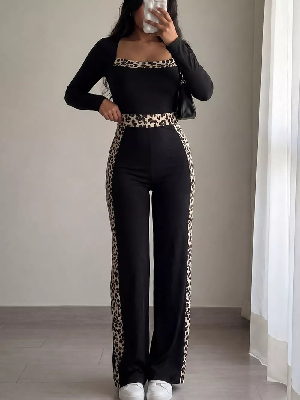 black jumpsuit with leopard and square neck