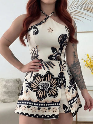 Floral halter neck romper with beige, black, and tan floral print.