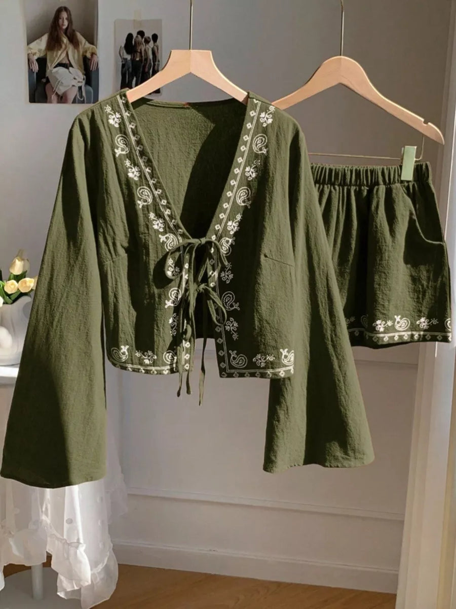 Army green embroidered tie-front top with bell sleeves and matching shorts set.