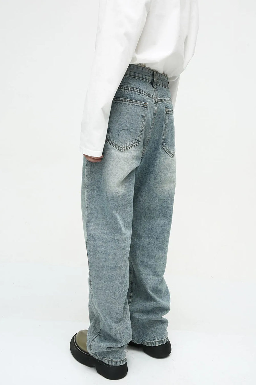 Baggy denim jeans in medium wash with subtle fade and relaxed fit.