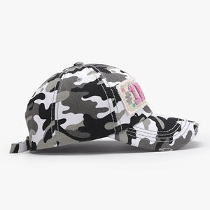 Camouflage patch baseball cap with embroidered detail in black and white camo.
