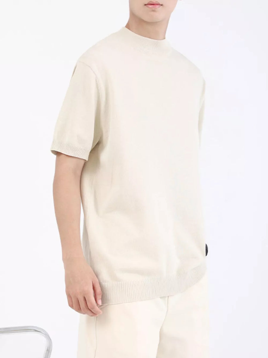 Men's apricot mock neck knitted t-shirt with short sleeves and ribbed trim.