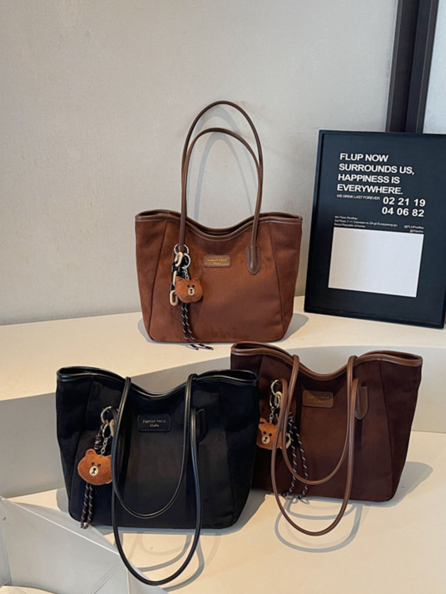tote in camel featuring top handles and boxy fit