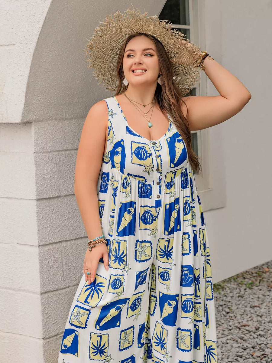 Plus-size relaxed jumpsuit with nautical print, V-neck, button front, and wide legs.