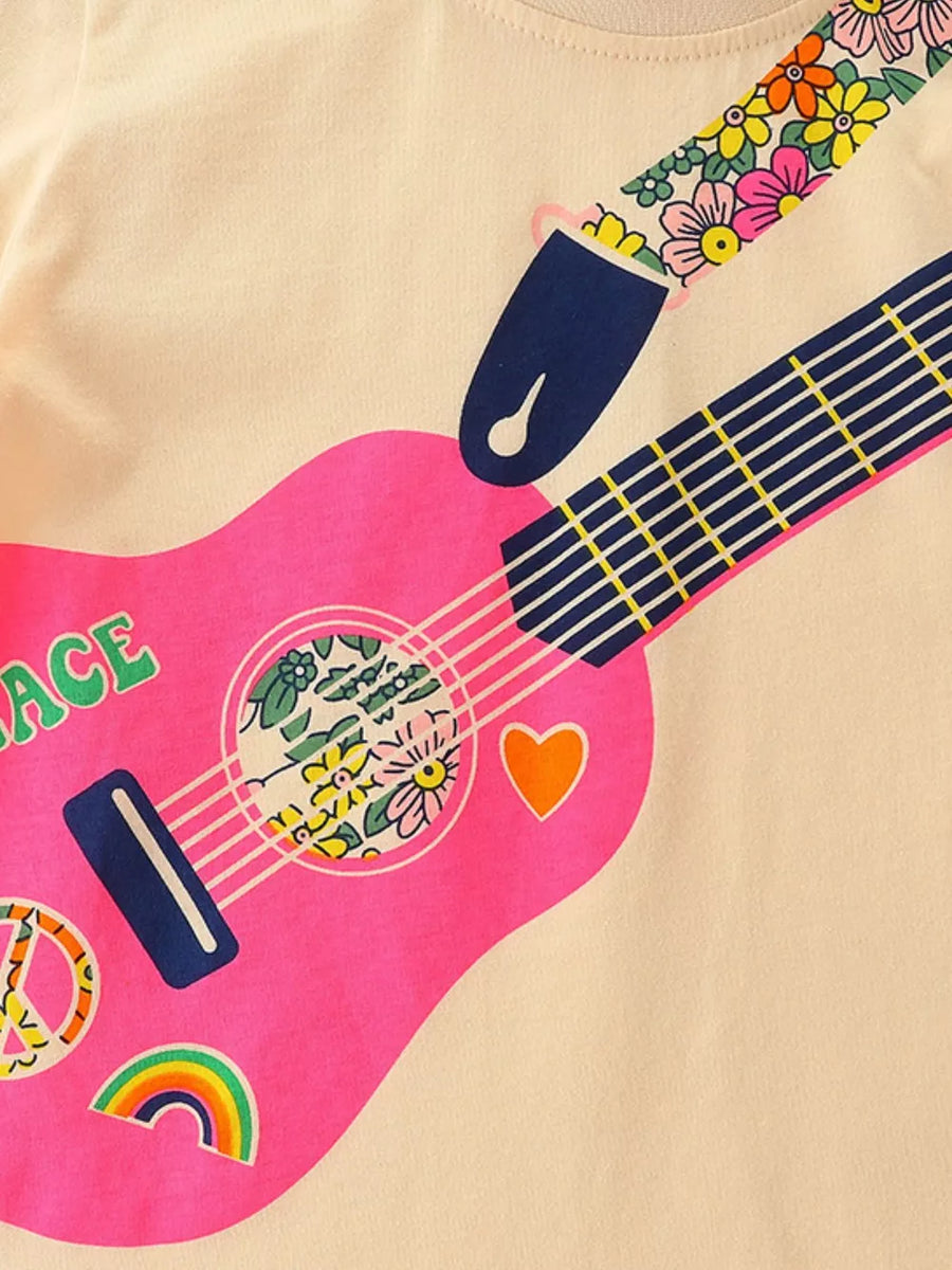 Toddler cream cotton crew neck t-shirt with a pink guitar graphic, floral strap, and peace signs.