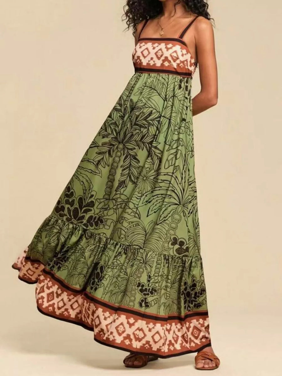 Moss green maxi dress with tropical print, square neck, tiered skirt, and patterned hem.