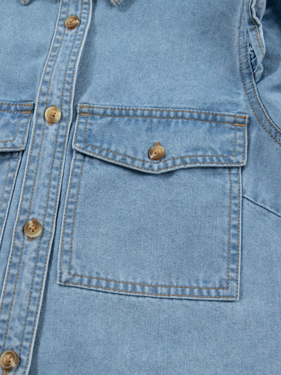 Light wash denim button-down shirt with two chest pockets and ruffled details.