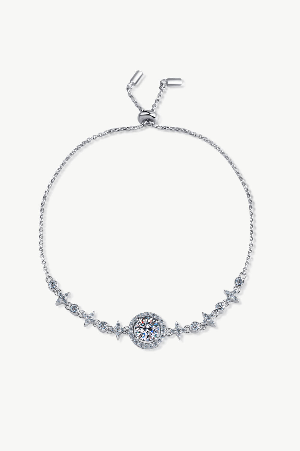 Silver moissanite halo bracelet with star accents and adjustable slider clasp.