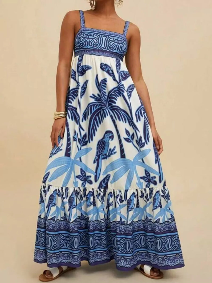 Maxi dress with square neck, tropical print, and tiered hem in blue and white.