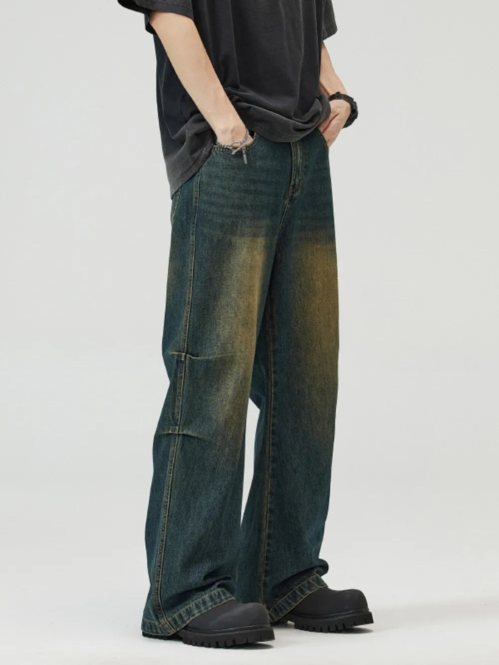 Vintage wash wide-leg men's jeans in blue-green cotton with a baggy fit.
