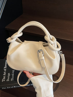 Off-white ruched crossbody bag with knot handle and adjustable strap