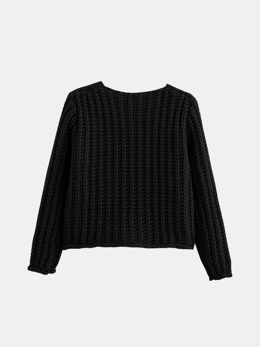 Black chunky knit cardigan with ribbed texture and long sleeves