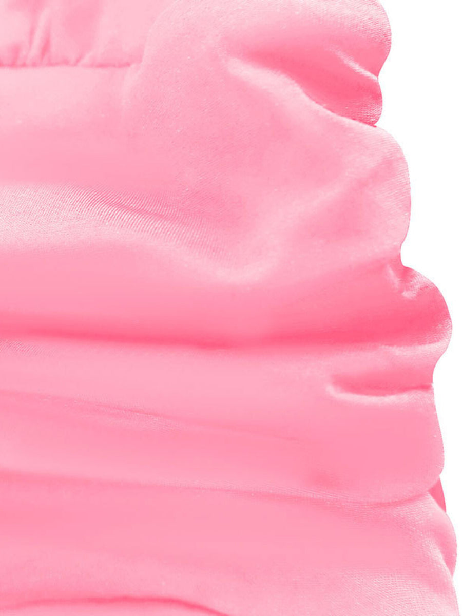Pink ruffle hem dress detail showing fabric texture and scalloped edge.