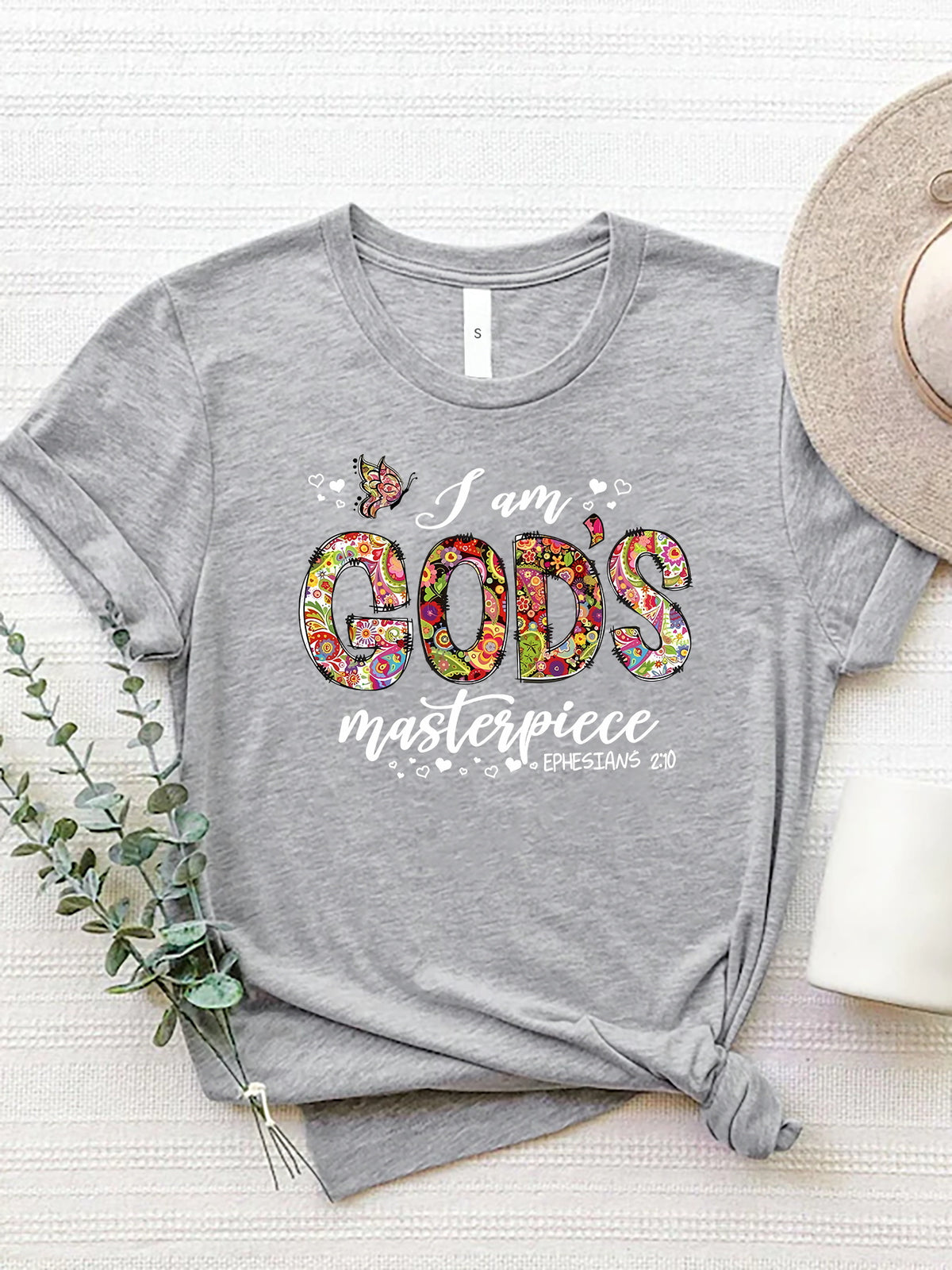 Light Gray t-shirt with floral typography graphic that reads "I am GOD's masterpiece".