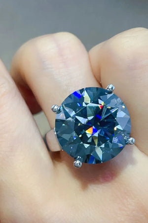 Royal blue moissanite cocktail ring with a large, brilliant-cut stone.