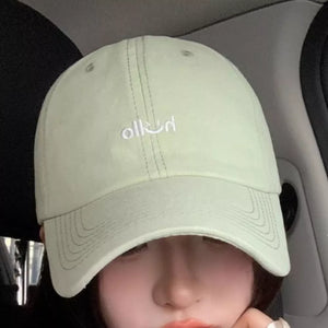 Light green cotton baseball cap with white embroidery detail