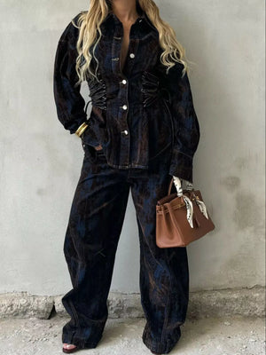 Dark blue denim set with lace-up corset detail on jacket and wide-leg pants.