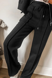 Black seamed joggers with drawstring waist and zip-up lounge set detail