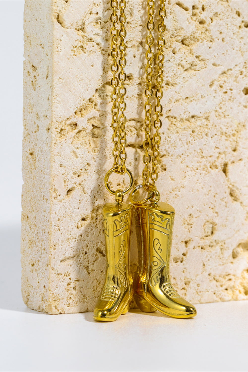 Gold cowboy boot charm necklace with 18K gold plating and intricate detailing.