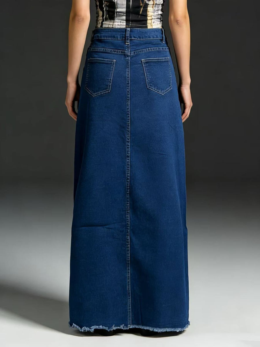Maxi denim skirt in dark blue with raw hem and two back pockets.