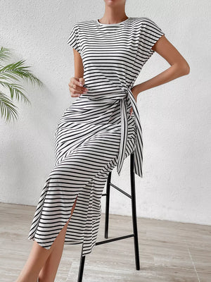 Striped midi dress with short sleeves, round neck, tie waist, and side slit.