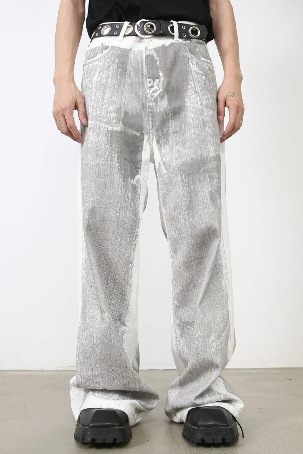 Metallic panel wide leg trousers in light, featuring a textured metallic finish and a relaxed fit.