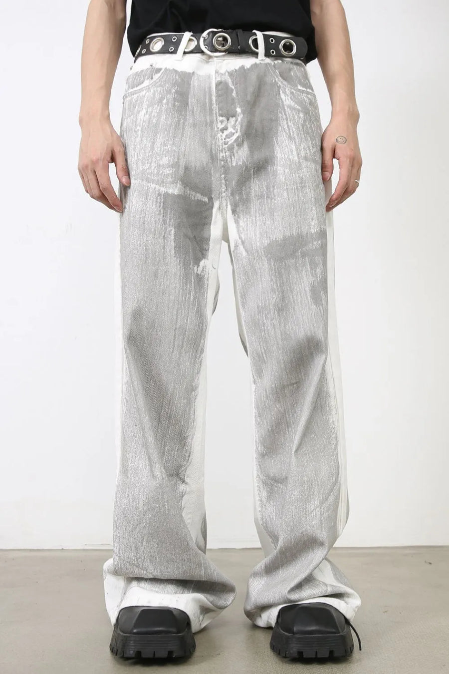 Metallic panel wide leg trousers in light, featuring a textured metallic finish and a relaxed fit.