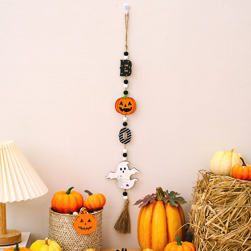 Halloween garland with ghost, pumpkin, and letter charms in black, orange, and white.