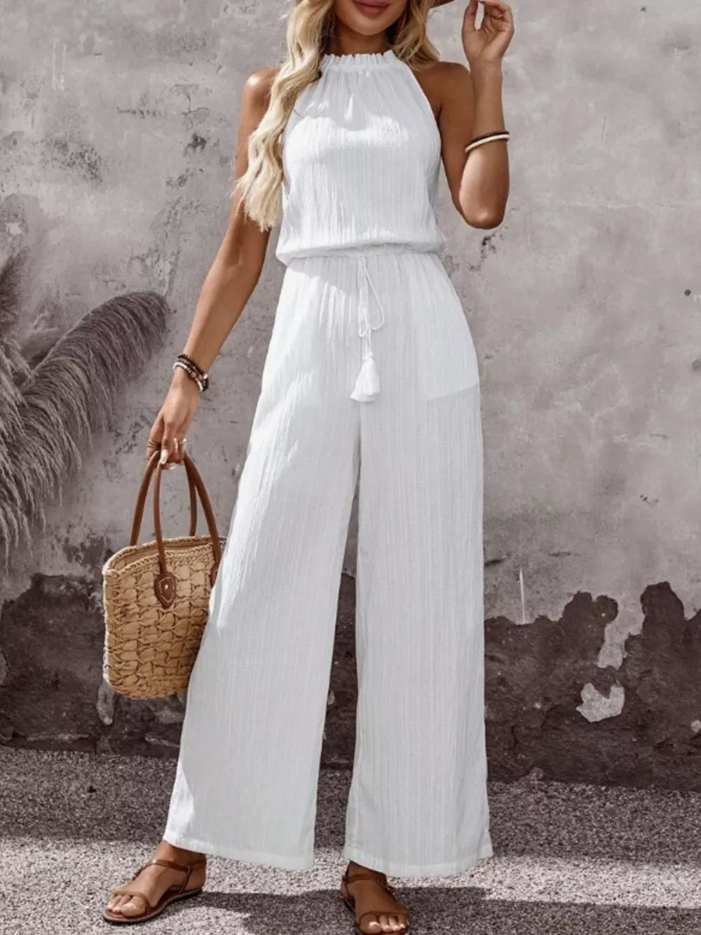 White crinkled halter jumpsuit with drawstring tassel and wide legs