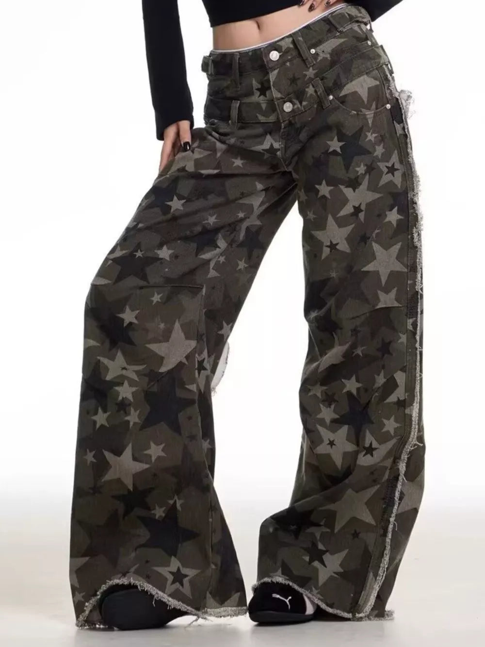 Star-embellished distressed wide-leg jeans in cotton with raw hem.