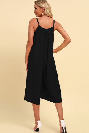 Black culotte jumpsuit with gathered bodice and spaghetti straps.