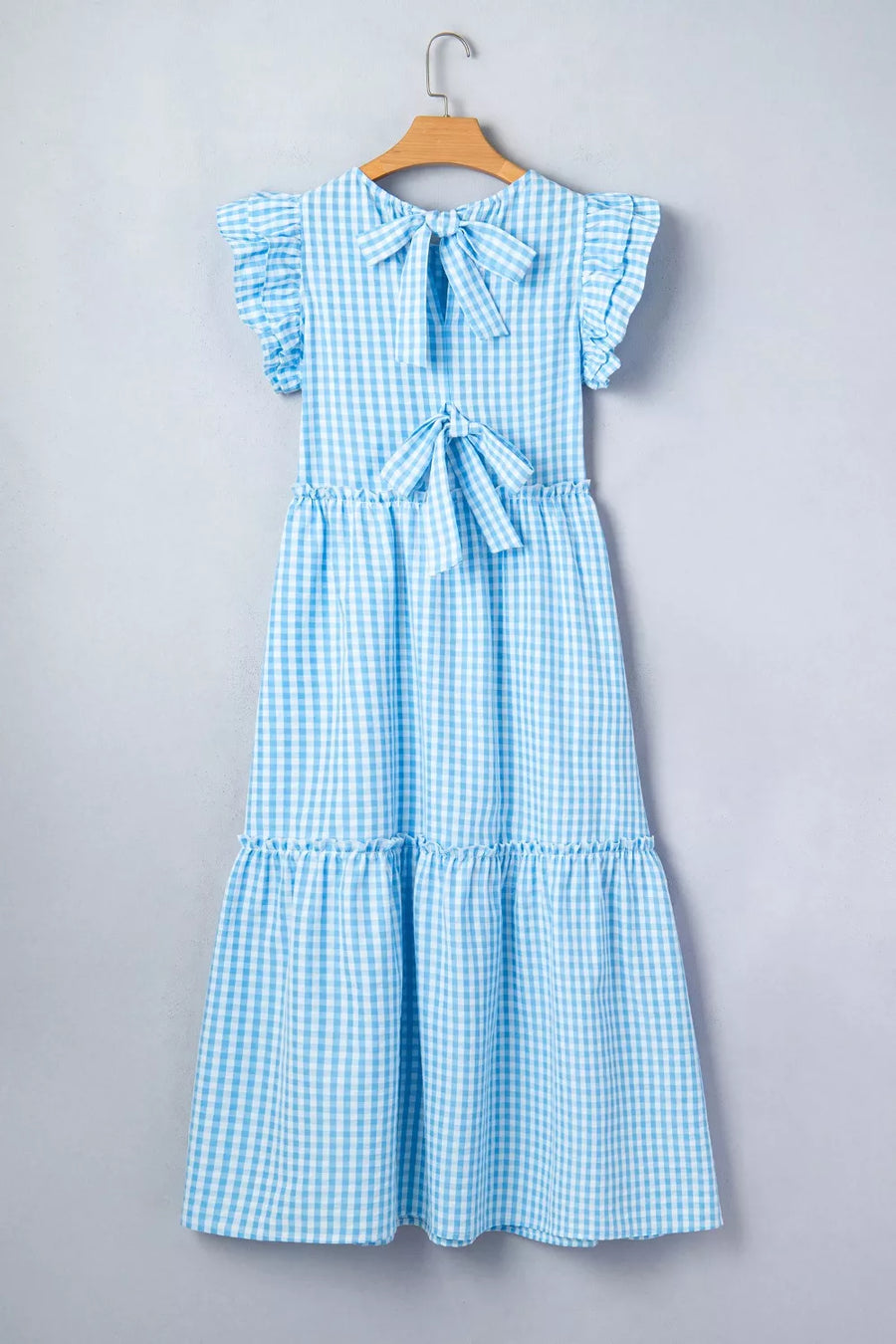 Blue gingham tiered maxi dress with ruffled sleeves and knot back detail