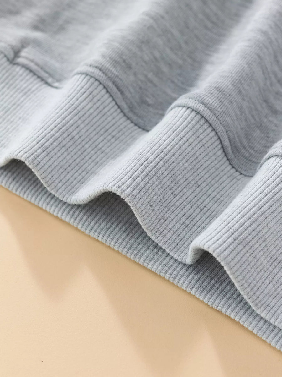 Light gray baby sweatshirt with ribbed cuffs and hem detail