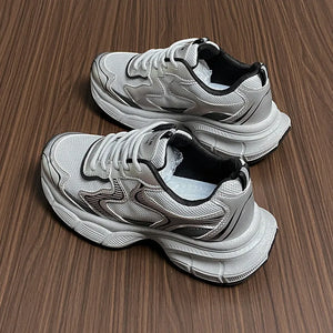 Silver metallic mesh chunky trainers with athletic design and breathable mesh.