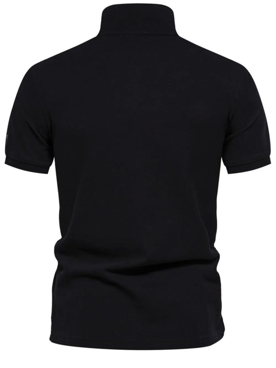 Black piqué polo shirt with short sleeves and embroidered detail on the left sleeve.