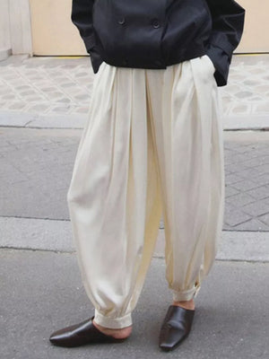 Cream wide-leg pants with full-length and drawstring