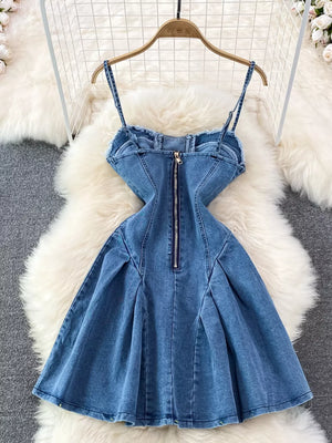 Blue denim a-line dress with corset detail, spaghetti straps, and a back zipper.