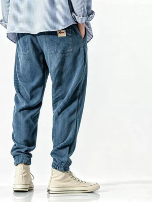 joggers in denim blue featuring drawstring waist and tapered fit