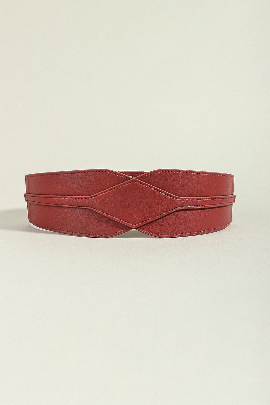 Burgundy elastic belt with sculpted waist detail and criss-cross design